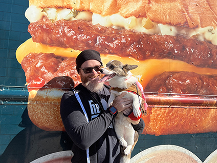 man with dog at swensons food truck